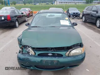1999 Ford Escort LX z VIN 1FAFP10P1XW230023, wystawiony jako IAAI lot #42486934 z przebiegiem 41 468 mil mil oraz . Historia ofert i sprzedaży dostępna na DreamBid. Obrazek 12.