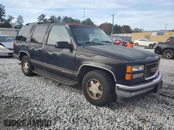 1999 GMC Yukon with VIN 1GKEC13R7XJ802387, listed as a Copart auction lot 82819934 with 438,574 mi miles and Salvage Title. Bid and sale history available at carsss.com. Image 4.