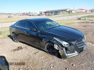 2014 Cadillac CTS Luxury AWD z VIN 1G6AX5SX9E0177017, wystawiony jako IAAI lot #42038429 z przebiegiem 113 656 mil mil oraz . Historia ofert i sprzedaży dostępna na DreamBid. Obrazek 1.