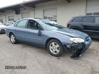 2000 Ford Taurus SEL with VIN 1FAFP56S2YG160062, listed as a Copart auction lot 82297744 with 97,218 mi miles and Salvage title. Bid and sale history available at DreamBid. Image 4.
