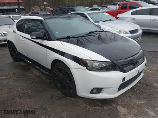 2011 Scion tC with VIN JTKJF5C76B3008753, listed as a IAAI auction lot 41616781 with 144,414 mi miles. Bid and sale history available at carsss.com. Image 1.
