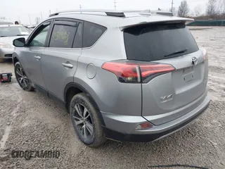 2018 Toyota RAV4 XLE with VIN 2T3RFREV1JW842728, listed as a IAAI auction lot 41519668 with 149,670 mi miles. Bid and sale history available at carsss.com. Image 3.