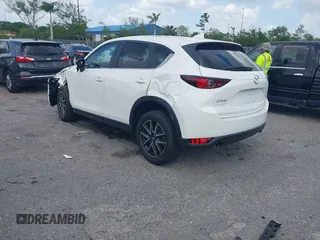 2018 Mazda CX-5 Touring z VIN JM3KFACM6J1419663, wystawiony jako IAAI lot #41879677 z przebiegiem 115 224 mil mil oraz . Historia ofert i sprzedaży dostępna na DreamBid. Obrazek 3.