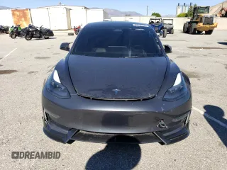 2023 Tesla Model 3 Long Range with VIN 5YJ3E1EB4PF633935, listed as a Copart auction lot 45238705 with 32,972 mi miles and Salvage Title. Bid and sale history available at DreamBid. Image 5.