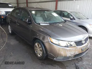 2010 Kia Forte EX with VIN KNAFU4A26A5882153, listed as a IAAI auction lot 41904559 with 162,554 mi miles. Bid and sale history available at carsss.com. Image 1.