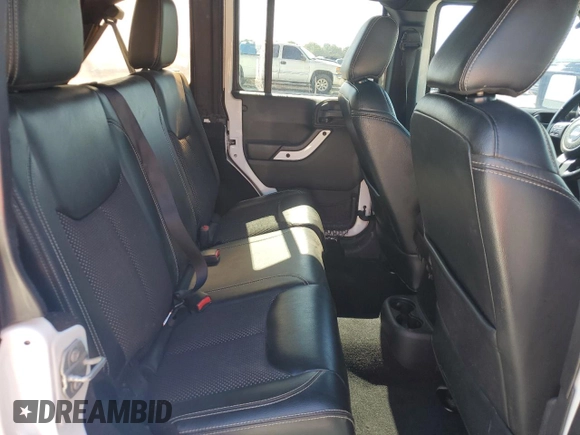 2015 Jeep Wrangler Unlimited Sahara with VIN 1C4BJWEG3FL584920, listed as a Copart auction lot 61843525 with 62,876 mi miles and Salvage title. Bid and sale history available at DreamBid. Image 11.