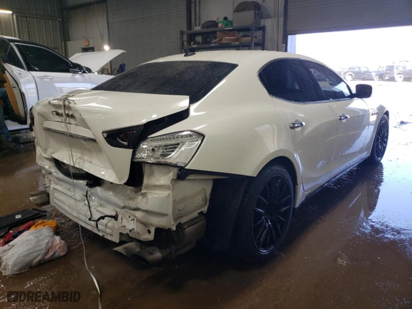 2014 Maserati Ghibli S Q4 with VIN ZAM57RTA4E1117703, listed as a Copart auction lot 48754515 with 104,284 mi miles and Salvage Title. Bid and sale history available at carsss.com. Image 3.