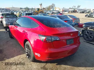 2022 Tesla Model 3 with VIN 5YJ3E1EA1NF288903, listed as a IAAI auction lot 41610215 with 96,050 mi miles and . Bid and sale history available at DreamBid. Image 3.
