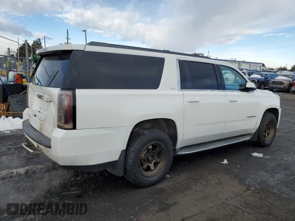 2015 GMC Yukon XL SLT with VIN 1GKS2HKC0FR220823, listed as a Copart auction lot 42155185 with 199,385 mi miles and Salvage Title. Bid and sale history available at carsss.com. Image 3.