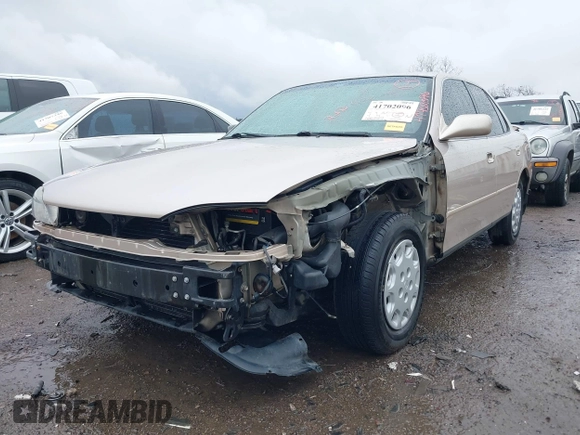 1996 Toyota Camry DX with VIN 4T1BG12K8TU738565, listed as a IAAI auction lot 41702096 with 100,587 mi miles. Bid and sale history available at carsss.com. Image 6.