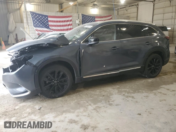 2021 Mazda CX-9 Grand Touring z VIN JM3TCBDYXM0516394, wystawiony jako Copart lot #52505215 z przebiegiem Nie podano mil oraz Szkoda całkowita • Salvage title. Historia ofert i sprzedaży dostępna na DreamBid. Obrazek 1.