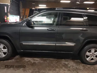 2011 Jeep Grand Cherokee 70th Anniversary with VIN 1J4RR4GG3BC566690, listed as a IAAI auction lot 41810545 with 173,886 mi miles. Bid and sale history available at carsss.com. Image 14.