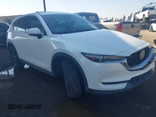 2017 Mazda CX-5 Grand Touring with VIN JM3KFBDL6H0164993, listed as a IAAI auction lot 41450556 with 97,733 mi miles. Bid and sale history available at carsss.com. Image 1.