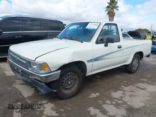 1992 Toyota Pickup DLX z VIN 4TARN81PXNZ004395, wystawiony jako IAAI lot #41729264 z przebiegiem 137 289 mil mil oraz . Historia ofert i sprzedaży dostępna na DreamBid. Obrazek 2.