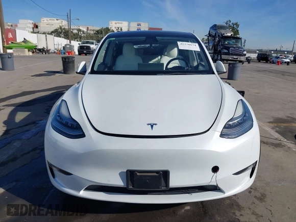 2021 Tesla Model Y Standard Range z VIN 5YJYGDED4MF162982, wystawiony jako IAAI lot #41378674 z przebiegiem 60 267 mil mil oraz . Historia ofert i sprzedaży dostępna na DreamBid. Obrazek 11.