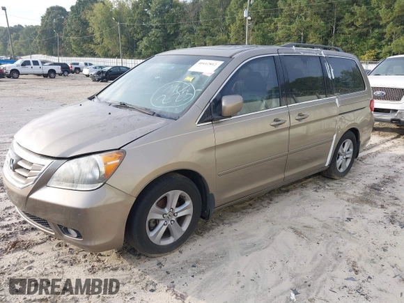 2010 Honda Odyssey Touring with VIN 5FNRL3H9XAB094779, listed as a IAAI auction lot 40412812 with 145,533 mi miles. Bid and sale history available at carsss.com. Image 2.