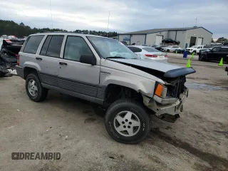 1995 Jeep Grand Cherokee Laredo with VIN 1J4GZ58S7SC517783, listed as a Copart auction lot 43057145 with 225,273 mi miles and Salvage Title. Bid and sale history available at carsss.com. Image 4.