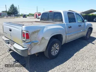 2006 Mitsubishi Raider LS z VIN 1Z7HC28K66S561607, wystawiony jako IAAI lot #42348069 z przebiegiem 162 231 mil mil oraz . Historia ofert i sprzedaży dostępna na DreamBid. Obrazek 4.