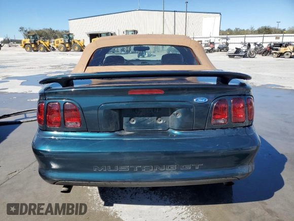 1996 Ford Mustang GT with VIN 1FALP45XXTF235504, listed as a Copart auction lot 45662595 with 57,849 mi miles and Salvage title. Bid and sale history available at DreamBid. Image 6.