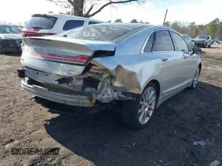 2015 Lincoln MKZ with VIN 3LN6L2G9XFR607285, listed as a IAAI auction lot 41572389 with 138,899 mi miles and . Bid and sale history available at DreamBid. Image 4.
