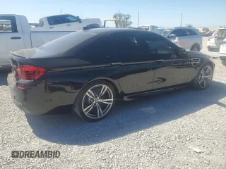 2014 BMW M5 z VIN WBSFV9C52ED593005, wystawiony jako Copart lot #49054395 z przebiegiem 71 213 mil mil oraz Szkoda całkowita • Salvage title. Historia ofert i sprzedaży dostępna na DreamBid. Obrazek 3.
