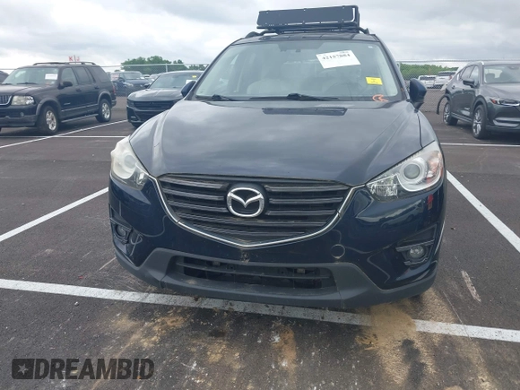 2016 Mazda CX-5 Grand Touring with VIN JM3KE2DYXG0890174, listed as a IAAI auction lot 42157884 with 141,873 mi miles. Bid and sale history available at carsss.com. Image 12.