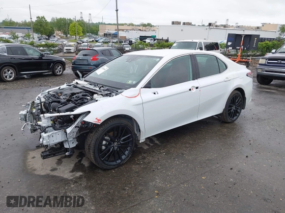 2022 Toyota Camry Hybrid XSE z VIN 4T1K31AK5NU583117, wystawiony jako IAAI lot #42204189 z przebiegiem 22 639 mil mil oraz . Historia ofert i sprzedaży dostępna na DreamBid. Obrazek 23.