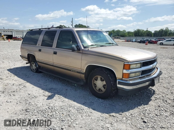 1999 Chevrolet Suburban with VIN 3GNEC16R6XG205408, listed as a Copart auction lot 57169415 with 303,412 mi miles and Salvage title. Bid and sale history available at DreamBid. Image 4.