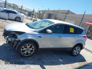 2013 Ford Escape SEL z VIN 1FMCU9H93DUA34811, wystawiony jako IAAI lot #42227559 z przebiegiem 126 495 mil mil oraz . Historia ofert i sprzedaży dostępna na DreamBid. Obrazek 15.
