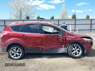 2014 Ford Escape Titanium with VIN 1FMCU9J91EUB53601, listed as a IAAI auction lot 42066465 with 105,933 mi miles and . Bid and sale history available at DreamBid. Image 13.