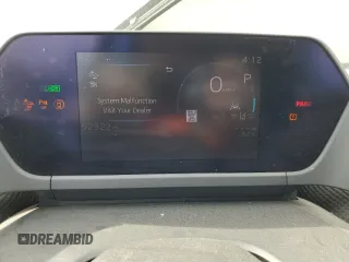 2023 Toyota bZ4X XLE z VIN JTMAAAAA6PA027254, wystawiony jako Copart lot #52069895 z przebiegiem 52 322 mil mil oraz Tytuł czysty. Historia ofert i sprzedaży dostępna na DreamBid. Obrazek 9.