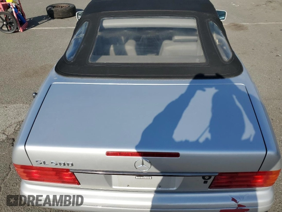 1997 Mercedes-Benz SL-Class with VIN WDBFA67F6VF141307, listed as a Copart auction lot 52554515 with 94,913 mi miles and Salvage Title. Bid and sale history available at carsss.com. Image 10.