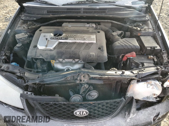 2005 Kia Spectra with VIN KNAFE161655093051, listed as a Copart auction lot 77821904 with 104,874 mi miles and Salvage Title. Bid and sale history available at carsss.com. Image 12.