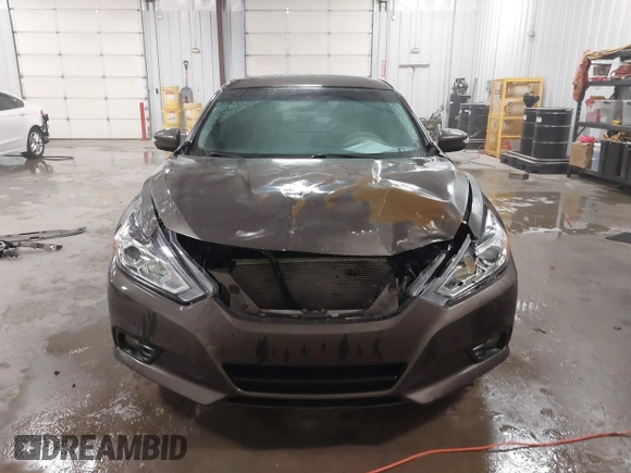 2016 Nissan Altima 2.5 S with VIN 1N4AL3AP4GC145811, listed as a IAAI auction lot 41424415 with 124,224 mi miles. Bid and sale history available at carsss.com. Image 13.