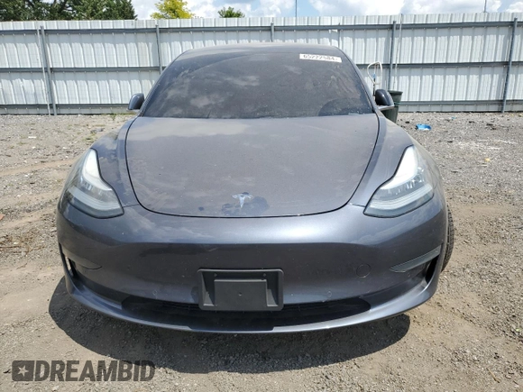 2020 Tesla Model 3 Standard Range Plus with VIN 5YJ3E1EA6LF614045, listed as a Copart auction lot 65222584 with 59,823 mi miles and Salvage Title. Bid and sale history available at DreamBid. Image 5.