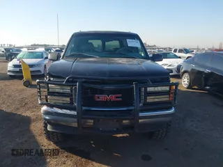 1999 GMC Suburban with VIN 3GKEC16R7XG527908, listed as a IAAI auction lot 41657788 with 216,894 mi miles. Bid and sale history available at carsss.com. Image 12.