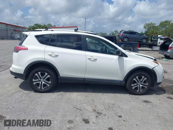 2016 Toyota RAV4 LE with VIN JTMZFREV2GJ096782, listed as a IAAI auction lot 41945319 with 76,866 mi miles. Bid and sale history available at carsss.com. Image 14.
