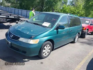 2002 Honda Odyssey EX z VIN 2HKRL18632H582789, wystawiony jako IAAI lot #42481029 z przebiegiem 272 380 mil mil oraz . Historia ofert i sprzedaży dostępna na DreamBid. Obrazek 2.