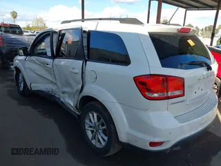 2014 Dodge Journey SXT with VIN 3C4PDCBGXET122969, listed as a IAAI auction lot 41741679 with 151,285 mi miles. Bid and sale history available at carsss.com. Image 3.