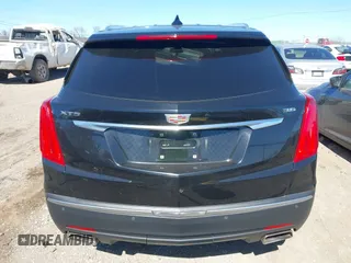 2017 Cadillac XT5 Premium Luxury FWD z VIN 1GYKNCRS8HZ127001, wystawiony jako IAAI lot #41698197 z przebiegiem 120 978 mil mil oraz . Historia ofert i sprzedaży dostępna na DreamBid. Obrazek 16.