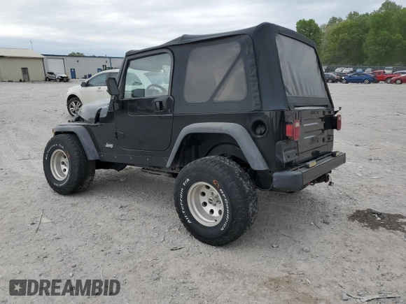 2000 Jeep Wrangler Sport with VIN 1J4FA49S9YP743515, listed as a Copart auction lot 53906305 with 247,349 mi miles and Salvage title. Bid and sale history available at DreamBid. Image 2.
