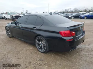 2013 BMW M5 with VIN WBSFV9C51DD095750, listed as a IAAI auction lot 40907304 with 93,014 mi miles. Bid and sale history available at carsss.com. Image 3.