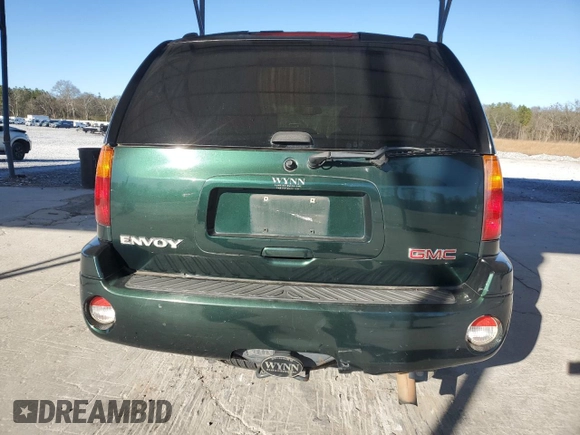 2004 GMC Envoy SLT z VIN 1GKDS13S942127830, wystawiony jako Copart lot #87165024 z przebiegiem 172 592 mil mil oraz Szkoda całkowita • Salvage title. Historia ofert i sprzedaży dostępna na DreamBid. Obrazek 6.