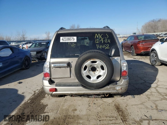 2004 Suzuki XL7 LX z VIN JS3TX92V344114452, wystawiony jako Copart lot #42338075 z przebiegiem 158 359 mil mil oraz Szkody całkowita. Historia ofert i sprzedaży dostępna na DreamBid. Obrazek 6.