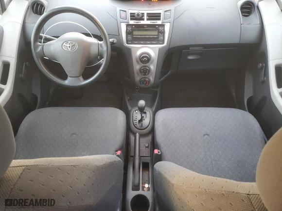 2009 Toyota Yaris with VIN JTDKT903995232885, listed as a Copart auction lot 71397904 with 112,804 mi miles and Salvage Title. Bid and sale history available at carsss.com. Image 8.