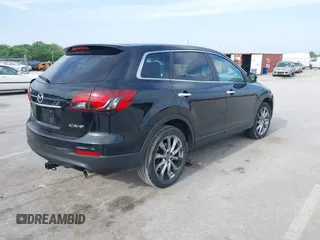 2015 Mazda CX-9 Grand Touring z VIN JM3TB2DA1F0456773, wystawiony jako IAAI lot #42257555 z przebiegiem 152 890 mil mil oraz . Historia ofert i sprzedaży dostępna na DreamBid. Obrazek 4.