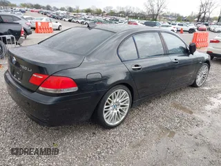 2007 BMW 7 Series 750Li with VIN WBAHN83577DT77290, listed as a IAAI auction lot 41908957 with 164,215 mi miles. Bid and sale history available at carsss.com. Image 4.