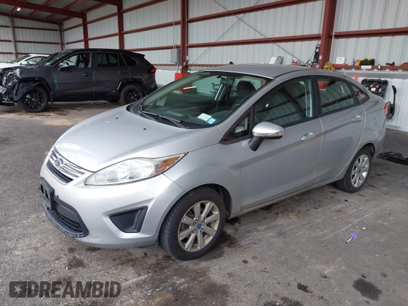 2013 Ford Fiesta SE with VIN 3FADP4BJ3DM173949, listed as a IAAI auction lot 40494276 with 141,061 mi miles. Bid and sale history available at carsss.com. Image 2.