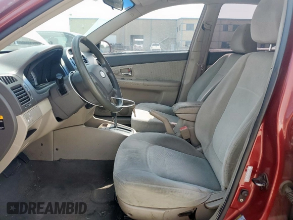 2007 Kia Spectra EX with VIN KNAFE122475378574, listed as a Copart auction lot 56921925 with 142,268 mi miles and Salvage title. Bid and sale history available at DreamBid. Image 7.