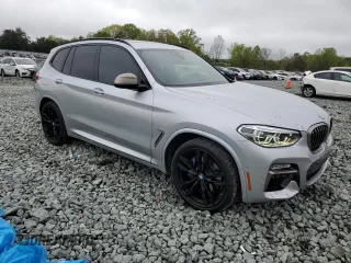2019 BMW X3 M40i with VIN 5UXTS3C55K0Z07974, listed as a Copart auction lot 52582205 with 71,739 mi miles and Salvage Title. Bid and sale history available at DreamBid. Image 4.